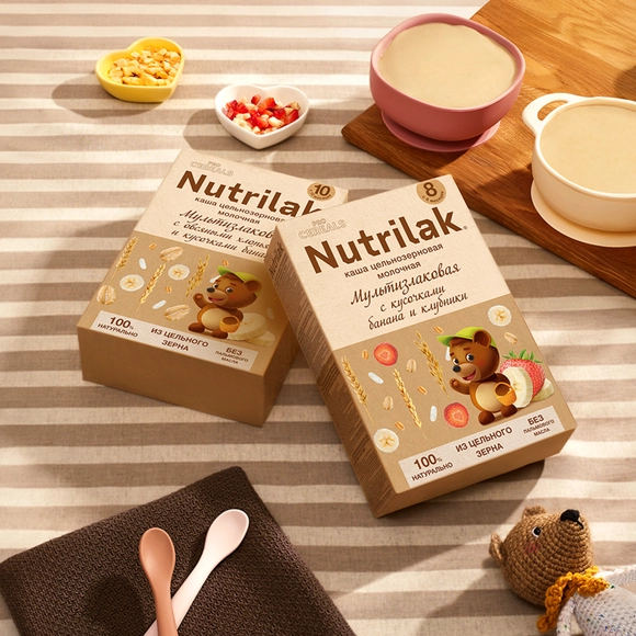 Детская каша молочная цельнозерновая Nutrilak мультизлаковая с кусочками банана и клубники 